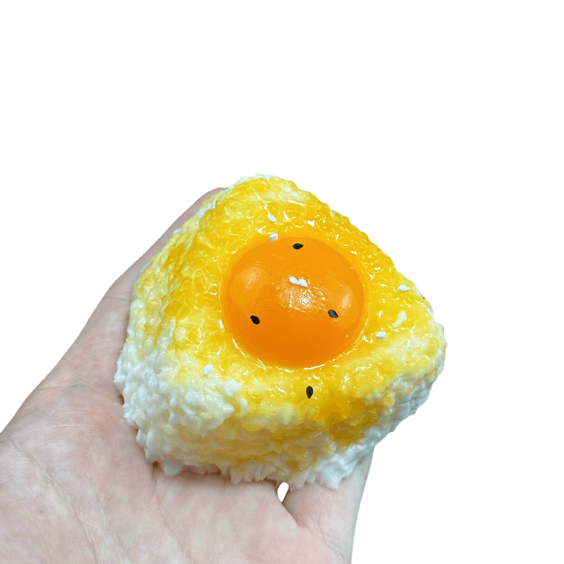 Squishy de bola de arroz con yema de huevo líquida
